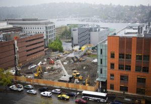 Construction crews work on building a new underground research laboratory for mice, rat and monkey research below the Portage Bay Vista greenspace in between Foege Hall and Hitchcock Hall at the University of Washington on Thursday, April 23, 2015. The facility is being built underground because the university is running out of space on campus and because the site is considered a "view corridor" to Portage Bay.